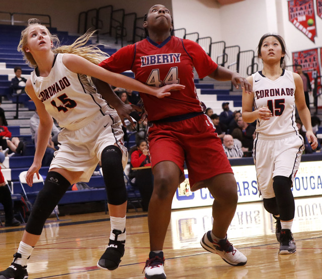 Liberty junior Dre’una Edwards (#44) prepares to grab a rebound during a basketball ga ...