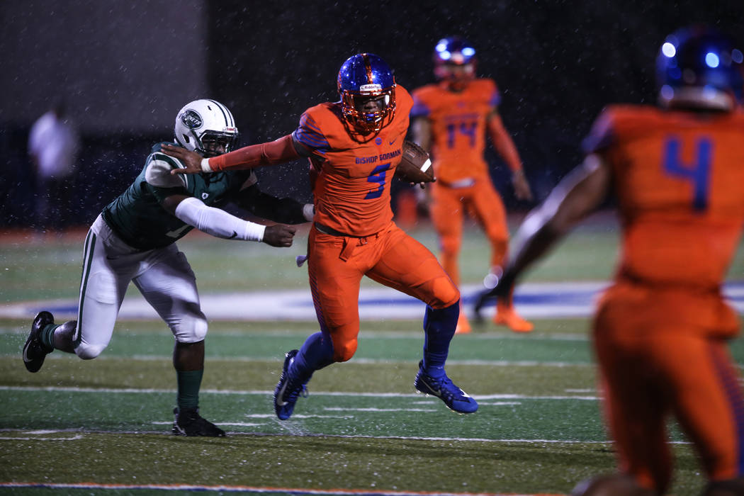 Bishop Gorman’s Brevin Jordan (9) runs past Miami Central’s Robert Hicks lll (1) ...