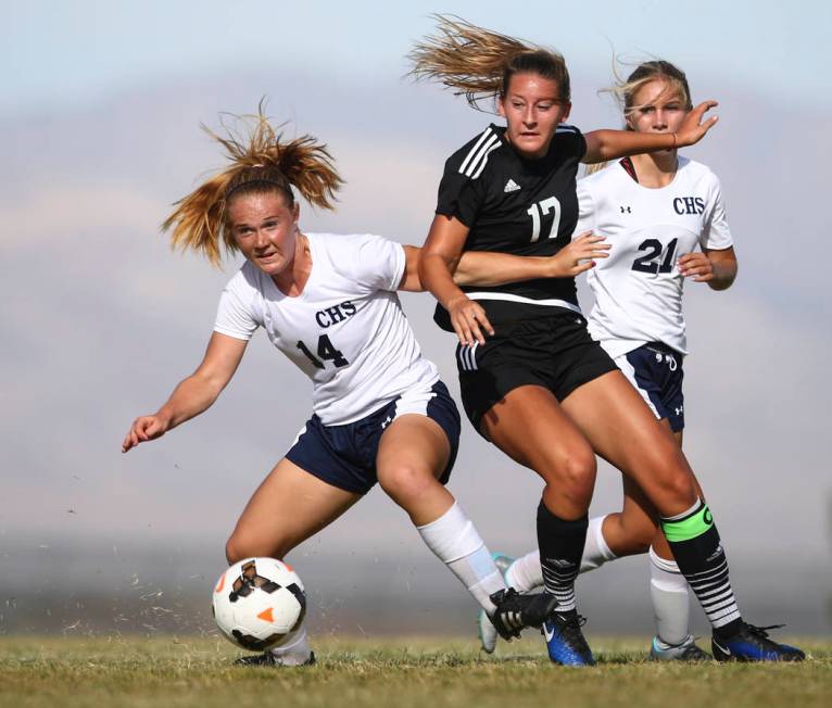 Centennial’s Dawn Madison Frederick (14) goes after the ball against Palo Verde’ ...