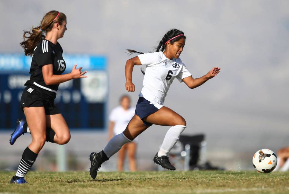 Centennial’s Dona Acierto (6) runs after the ball past Palo Verde’s Kassidy Sayl ...