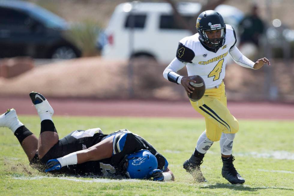 Clark’s Jared Jenkins (4) runs the ball against Sierra Vista in their football game at ...