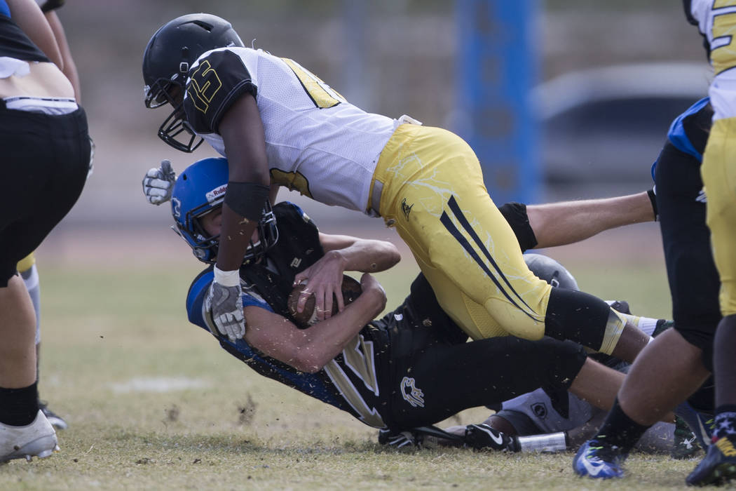 Sierra Vista’s Trevor Gentner (12) is sacked by Clark’s Antwan McClure (15) in t ...