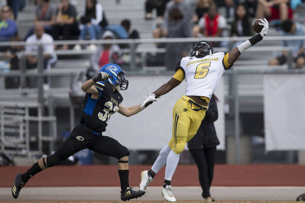 Clark’s Isaiah Bigby (6) leaps for a dropped pass against Sierra Vista in their footba ...