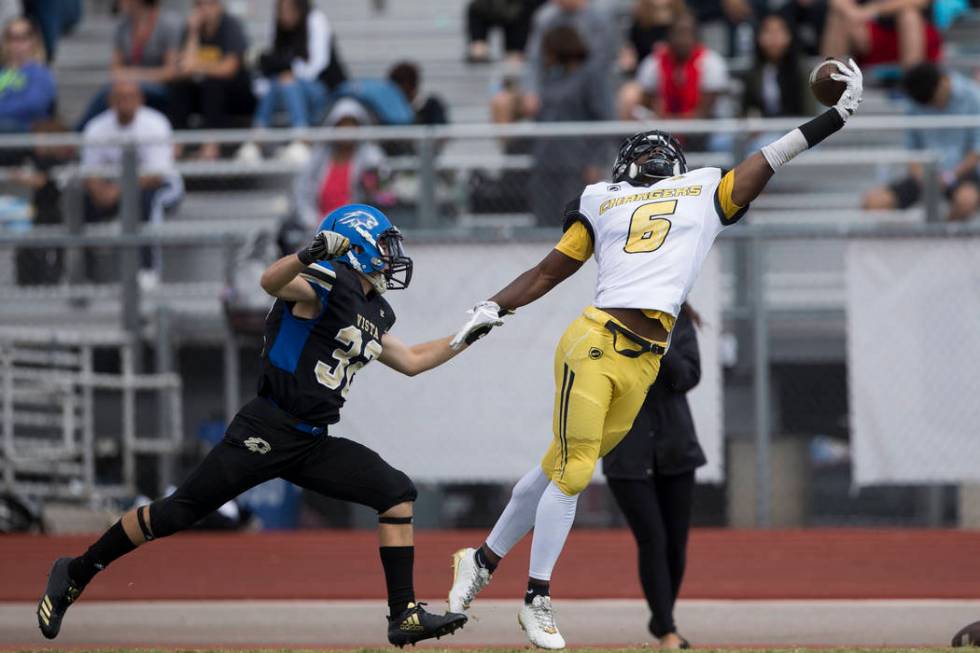 Clark’s Isaiah Bigby (6) leaps for a dropped pass against Sierra Vista in their footba ...