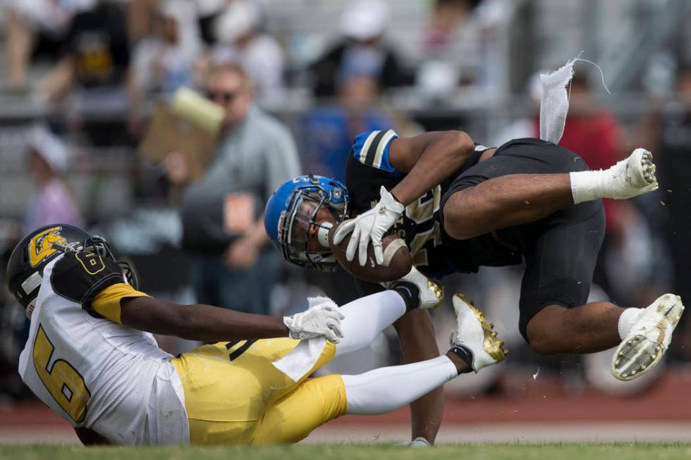 Sierra Vista’s Kaika Faatiliga (36) is tackled by Clark’s Isaiah Bigby (6) in th ...