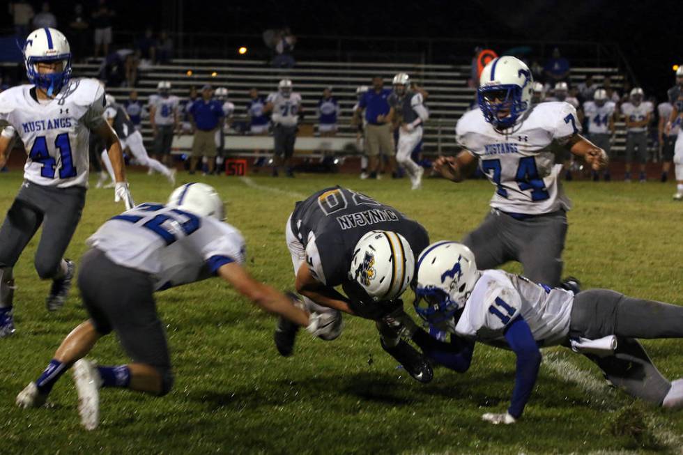 Boulder City High School junior Jimmy Dunagan generated 50 yards on 13 carries, trying to he ...