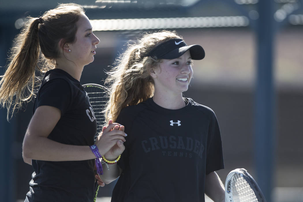 Faith Lutheran’s Summer Stadtlander, left, and Kelsie Seigle during their doubles tenn ...