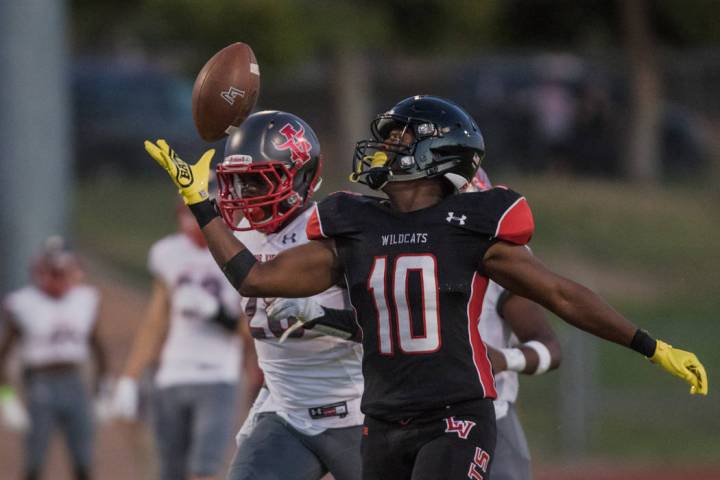 Las Vegas High School Wildcats running back Elijah Hicks prepares for the catch as Arbor Vie ...