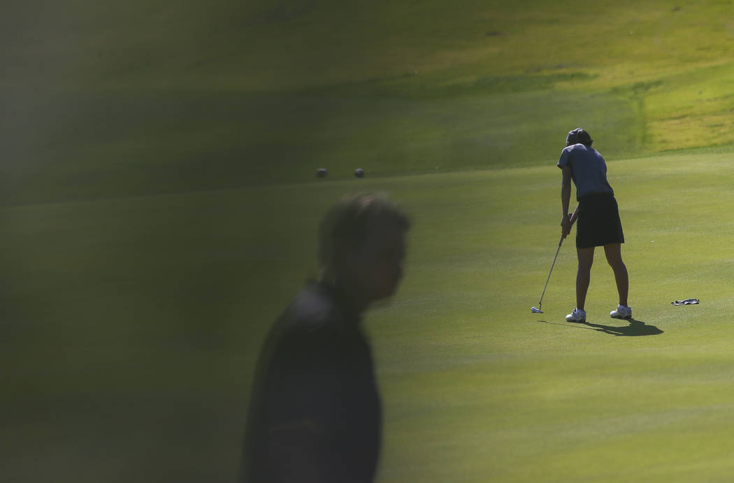 Clark’s Riana Mission putts during the Class 4A state girls golf tournament at Highlan ...