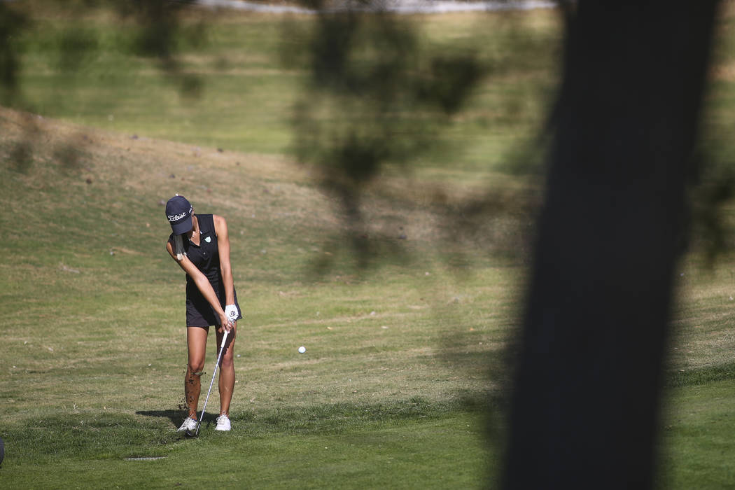 Centennial’s McKenzi Hall swings during the Class 4A state girls golf tournament at Hi ...