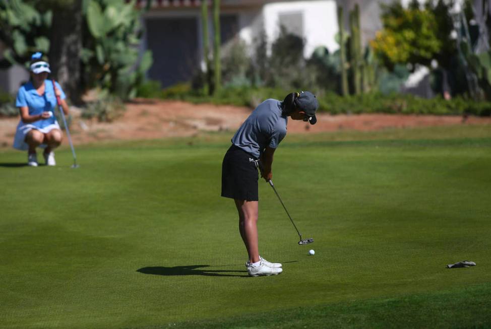 Clark’s Riana Mission putts during the Class 4A state girls golf tournament at Highlan ...