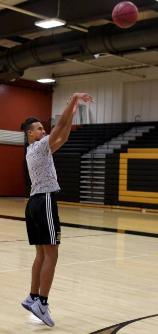 Clark High School senior Greg Foster shoots during basketball practice at Clark High School ...