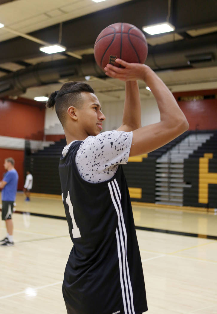 Clark High School senior Greg Foster shoots during basketball practice at Clark High School ...