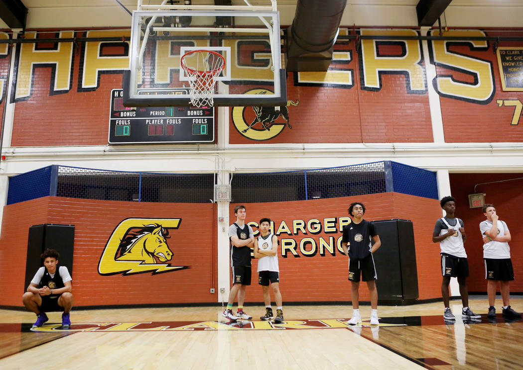 Players on the Clark High School basketball team line up for drills during basketball practi ...