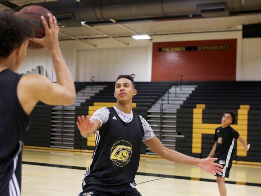 Clark High School senior Greg Foster guards during basketball practice at Clark High School ...