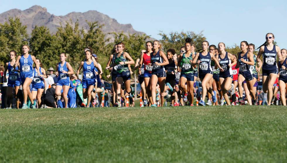 Runners compete during the Girls Cross Country Class 4A Sunrise Region race in Boulder City, ...