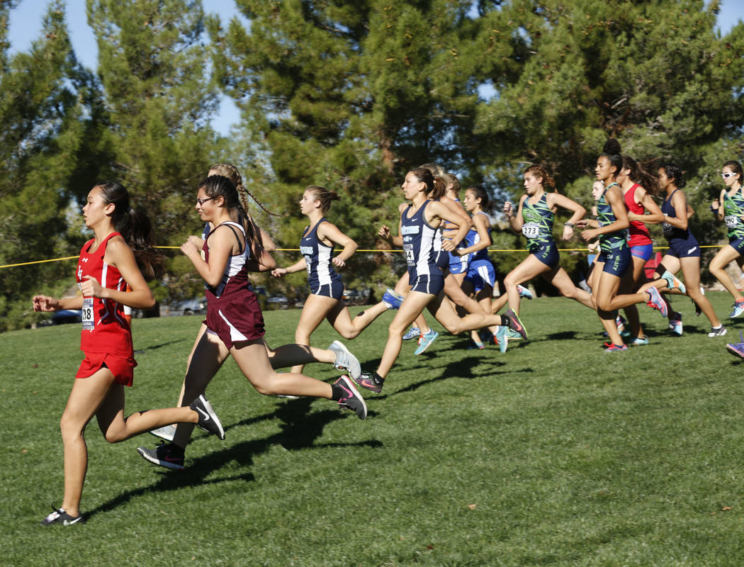 Runners compete during the Girls Cross Country Class 4A Sunrise Region race in Boulder City, ...