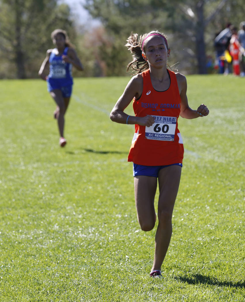 Bishop Gorman’s Emilia Puskas (60) and Sierra Vista’s Sarah Brown, left, compet ...