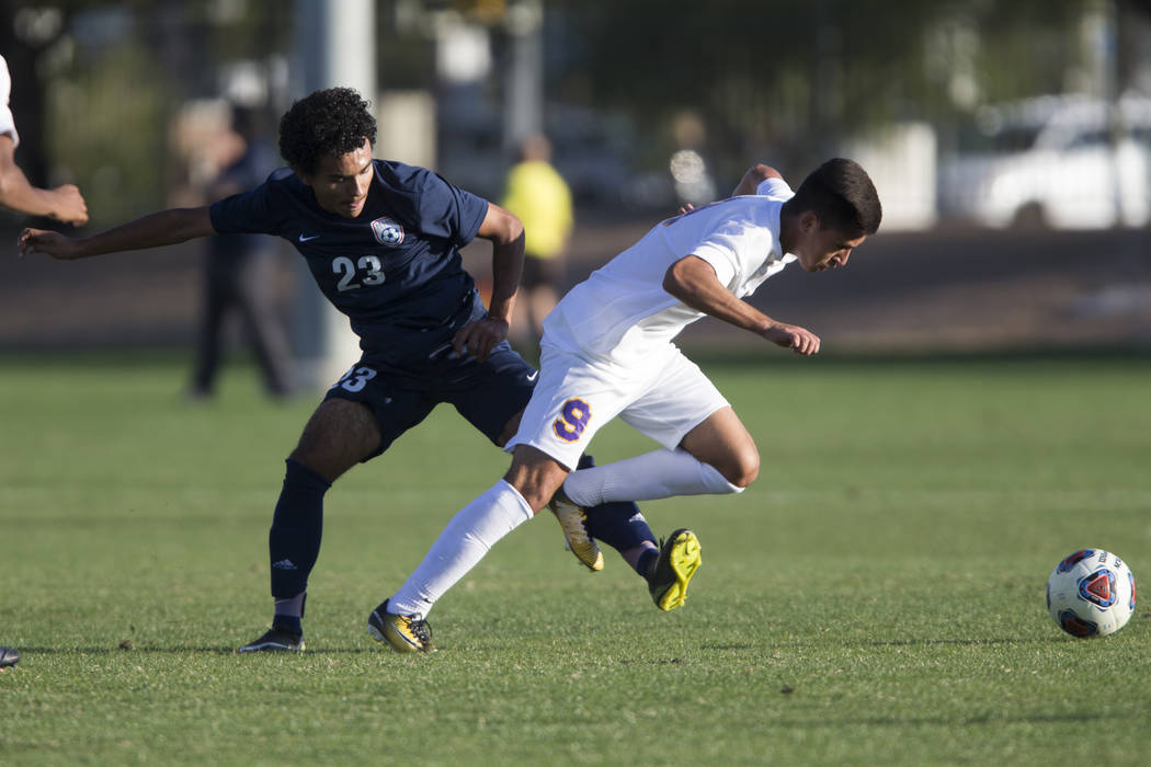 Durango’s Jaime Munguia (9) is fouled by Legacy’s Jose Miranda (23) in the playo ...