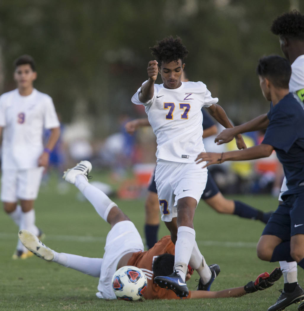 Durango’s William Hailu (77) kicks the ball to the goal in the playoff soccer game aga ...