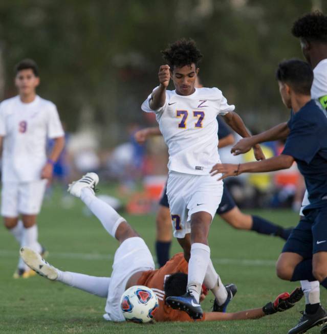 Durango’s William Hailu (77) kicks the ball to the goal in the playoff soccer game aga ...