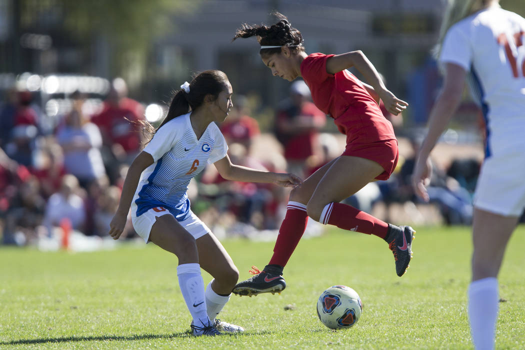 Bishop Gorman’s Caitlyn Rueca (6) defends against Arbor View’s Karissa Martinez ...