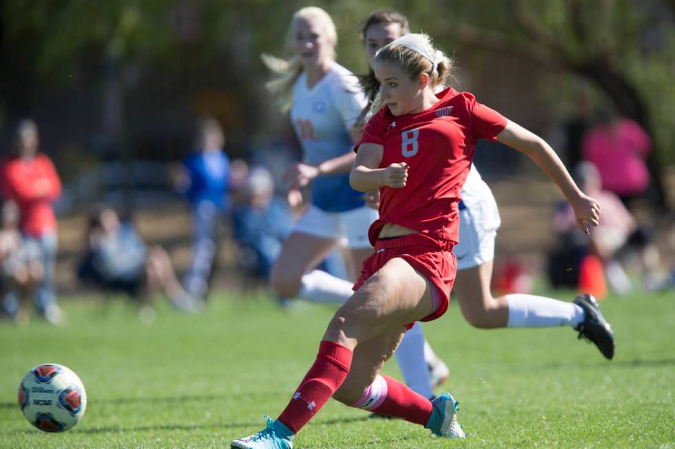 Arbor View’s Hannah Ferrara (8) kicks a ball to the goal against Bishop Gorman in the ...