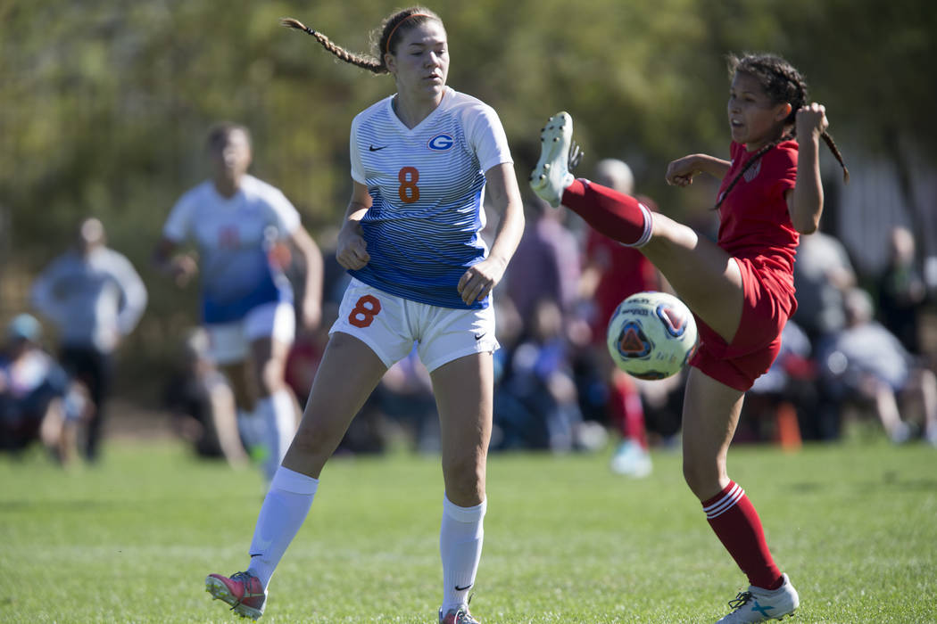 Bishop Gorman’s Emma Wright (8) fights for the ball against Arbor View’s Sierra ...