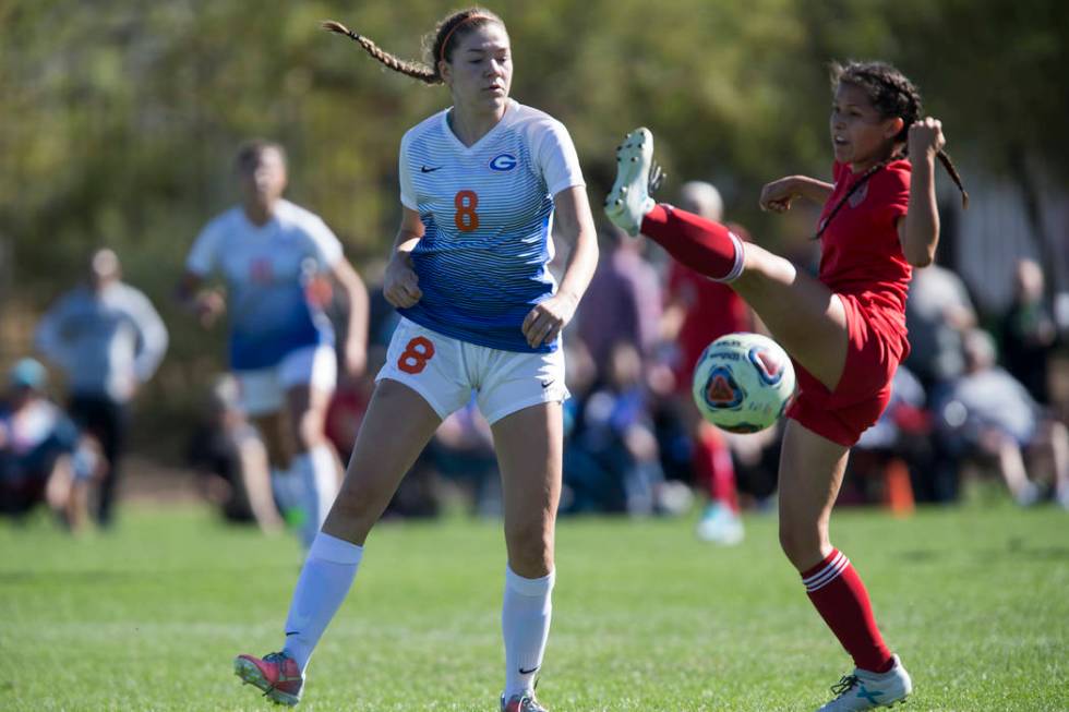 Bishop Gorman’s Emma Wright (8) fights for the ball against Arbor View’s Sierra ...