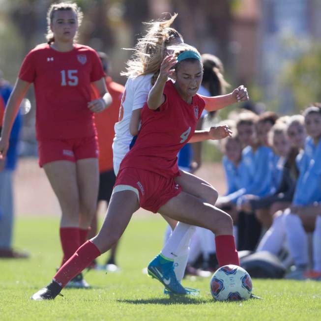 Arbor View’s Neally Peters (4) fights for the ball against Bishop Gorman’s Jacqu ...