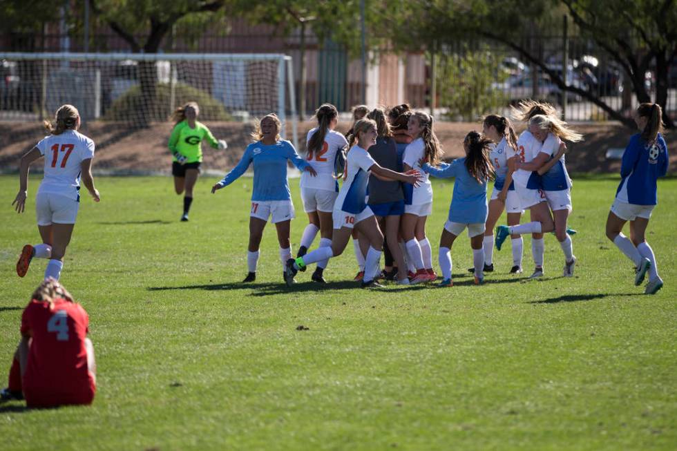 Bishop Gorman players celebrate their victory against Arbor View in the Sunset Region girl&# ...