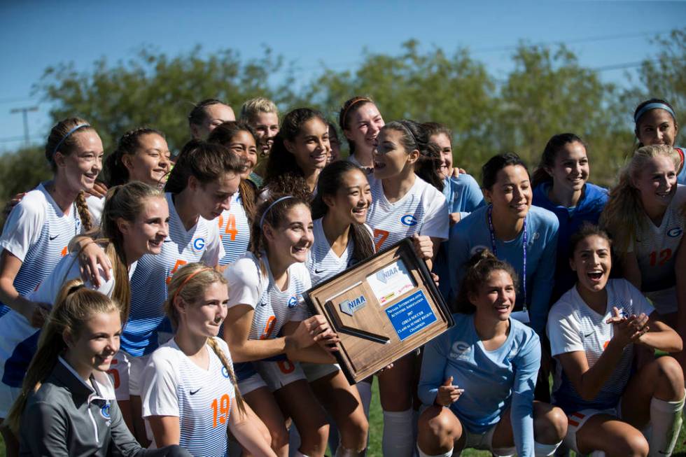 Bishop Gorman players celebrate their victory against Arbor View in the Sunset Region girl&# ...