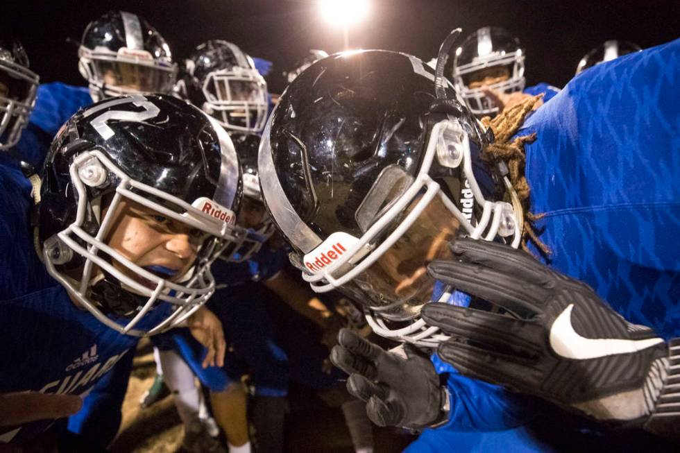 Desert Pines players celebrate their 48-0 victory over Sunrise Mountain High School followin ...