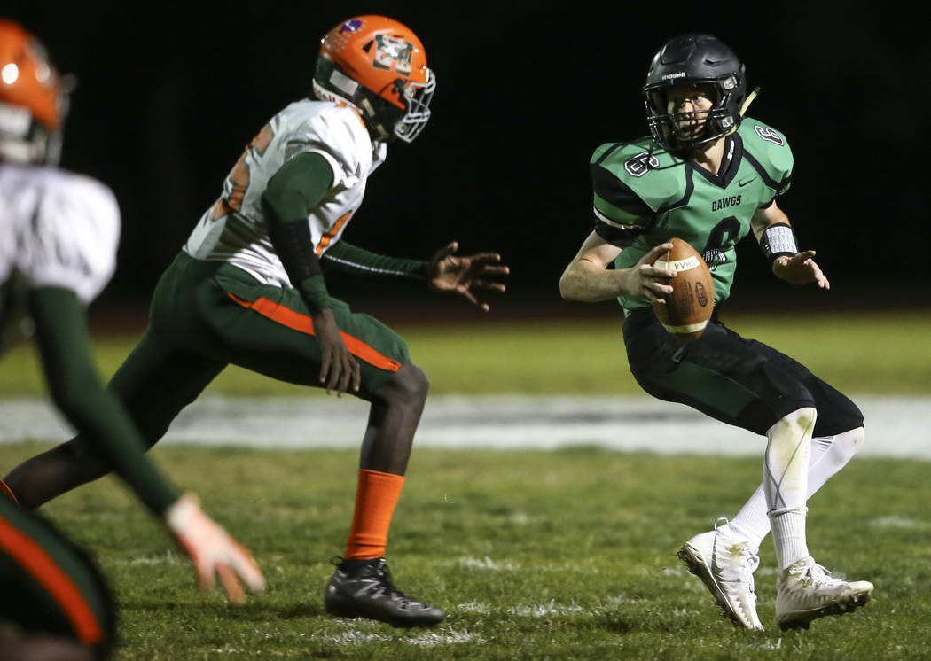 Mojave’s David Warren (15) looks to sack Virgin Valley’s Cade Anderson (6) durin ...