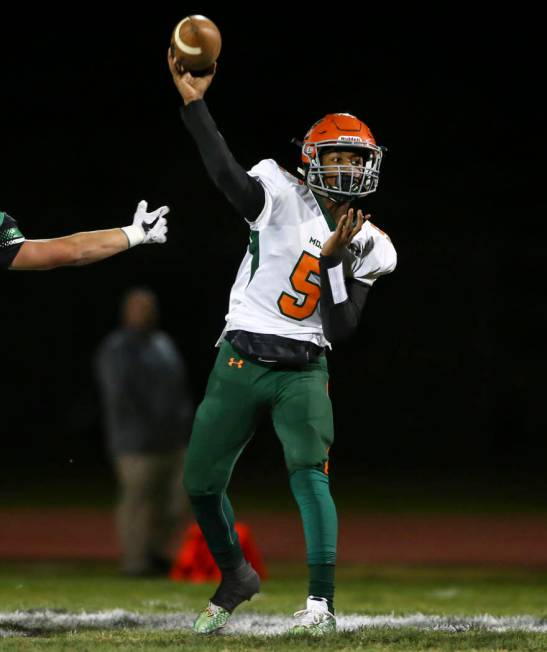 Mojave’s Xavier Delong (5) throws a pass during the Class 3A state quarterfinal game a ...