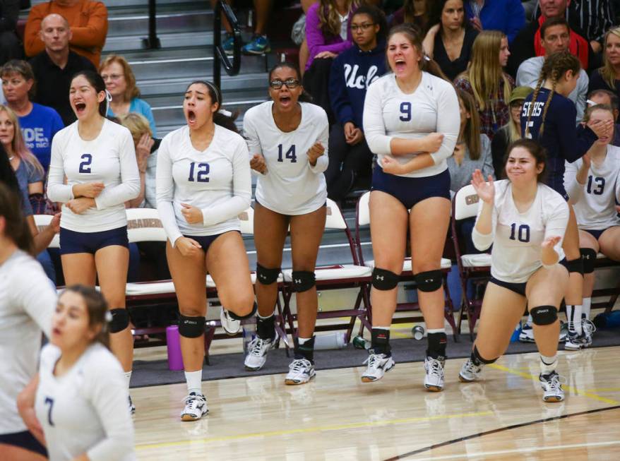 Shadow Ridge players celebrate while playing Coronado during the Class 4A state volleyball g ...