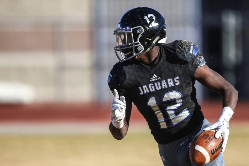 Desert Pines’ Jyden King (12) scores a touchdown against Spring Creek during the secon ...