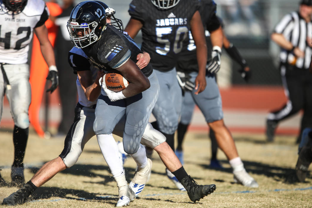 Desert Pines’ Jyden King (12) runs the ball against Spring Creek during the third quar ...