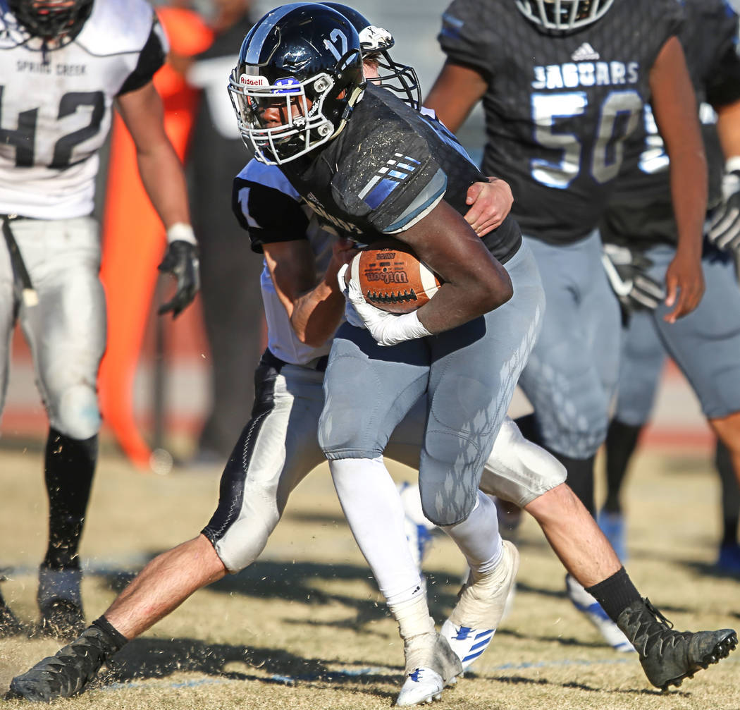 Desert Pines’ Jyden King (12) runs the ball against Spring Creek during the third quar ...