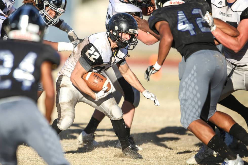 Spring Creek’s Jason Painter (22) runs the ball against Desert Pines during the fourth ...