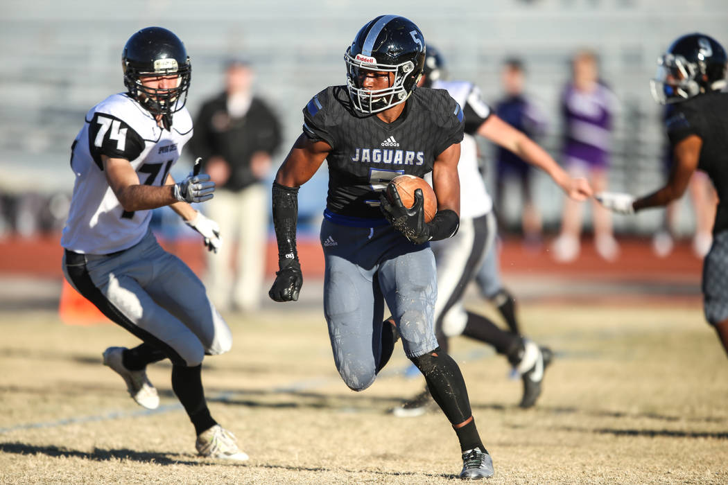 Desert Pines’ Jordan Howden (5) runs the ball against Spring Creek during the fourth q ...