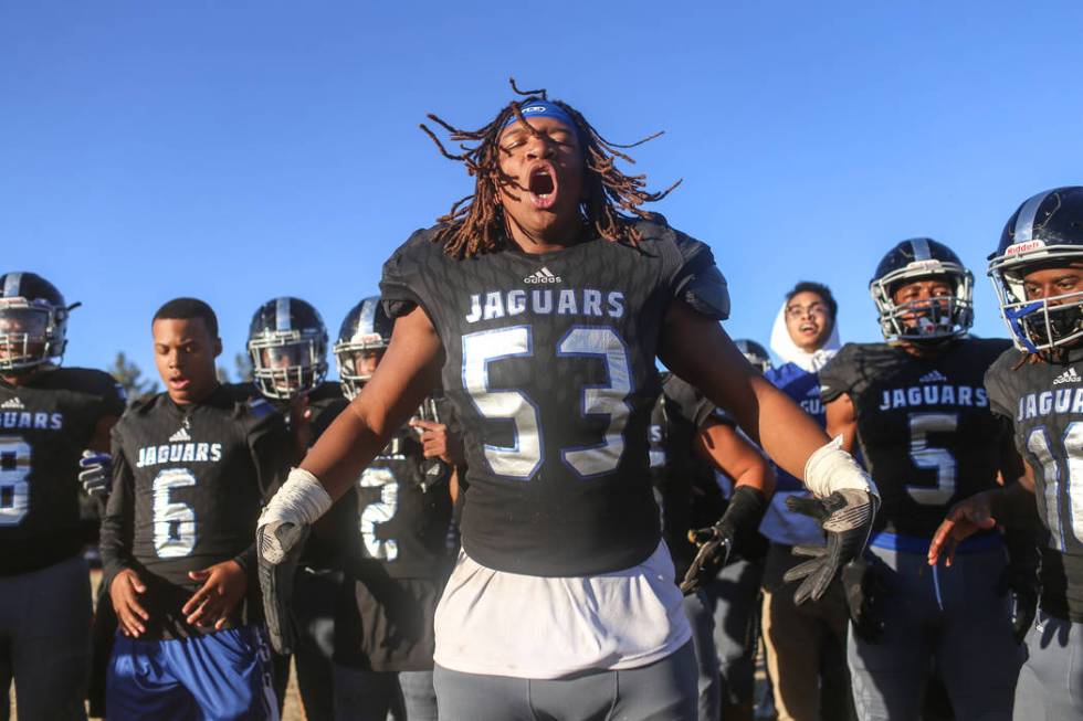 Desert Pines’ Lorenzo Sheldon Brown (53), center, celebrates with teammates after defe ...