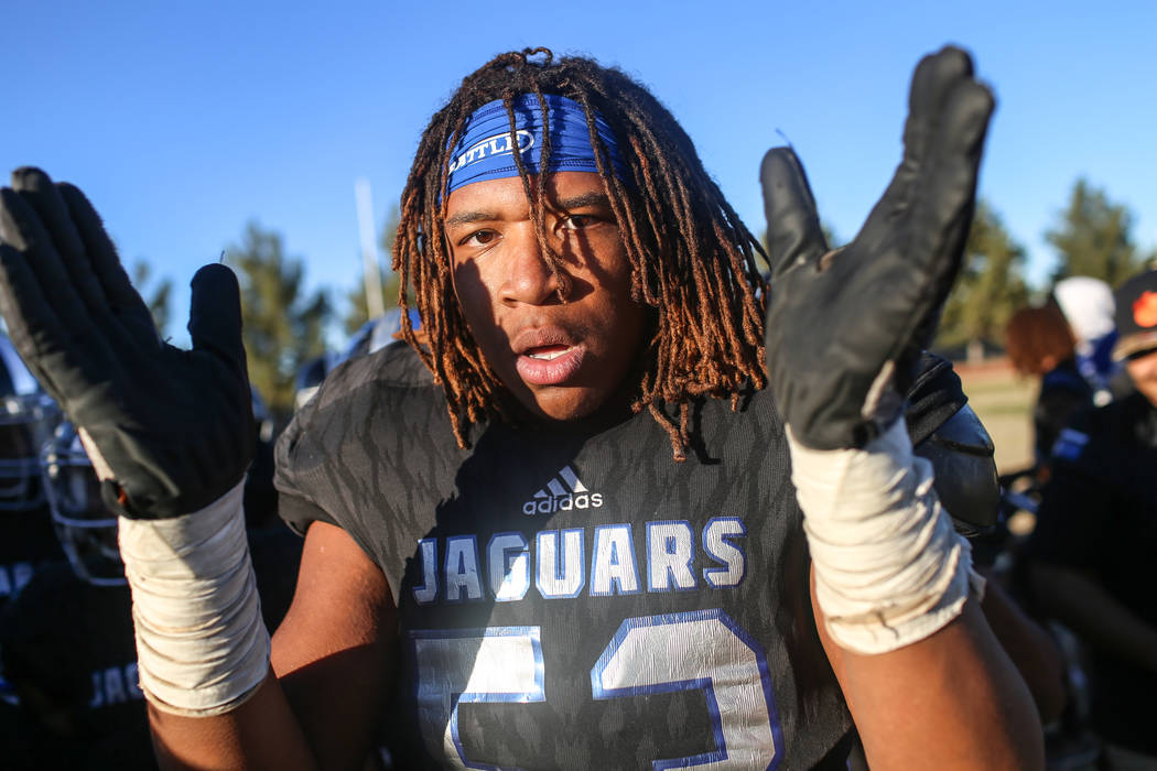 Desert Pines’ Lorenzo Sheldon Brown (53) celebrates after defeating Spring Creek 50-28 ...