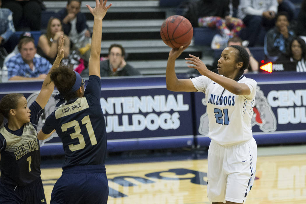 Centennial’s Justice Ethridge (21) takes a shot against Spring Valley in the girls bas ...