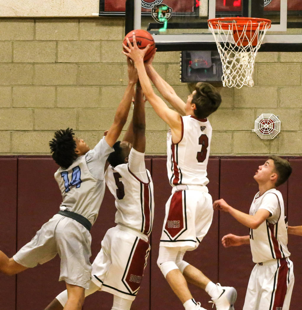 Canyon SpringsՠDaylon Valdovinos (14), third from left, Desert OasisՠManny Mitch ...