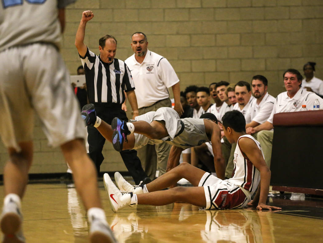 Canyon SpringsՠKevin Legardy (4), top, dives after the ball as Desert OasisՠNate ...