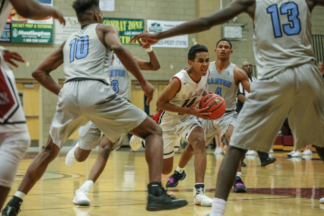 Desert OasisՠNate Van (14) dribbles the ball against Canyon Springs during the fourth ...