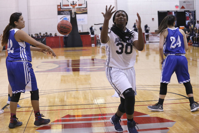 Agassi Prep’s Sharmayne Finley (30) reacts after the ball is knocked from her hands du ...