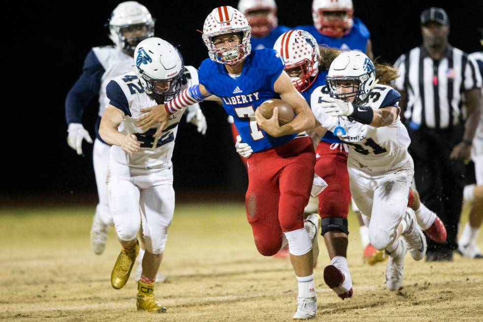 Liberty’s Kenyon Oblad (7) runs the ball against Foothill in their football game at Li ...