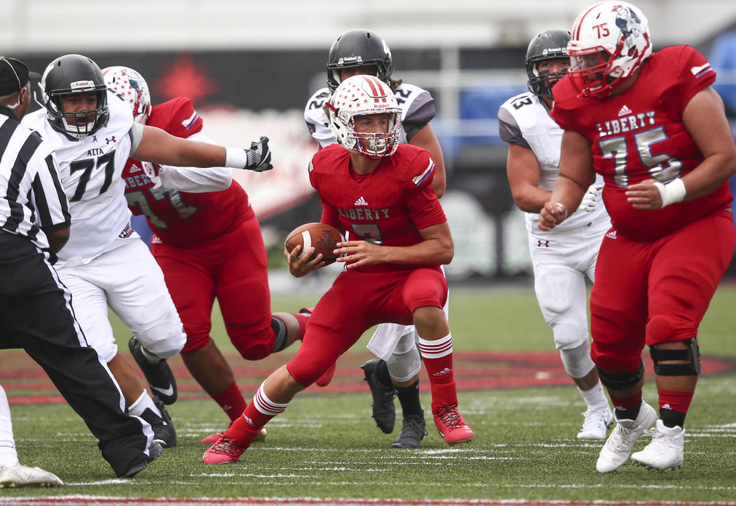 Liberty’s Kenyon Oblad (7) runs the ball against Alta during a football game at Sam Bo ...